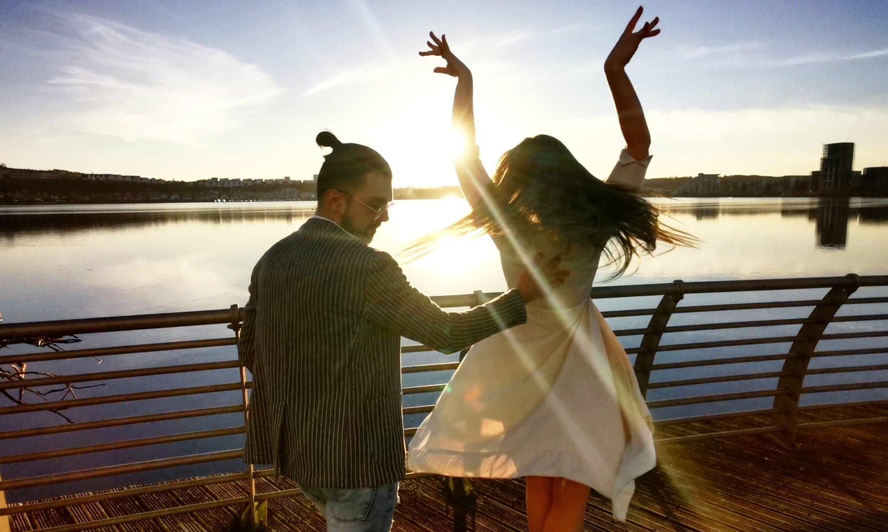 Dancing salsa in the sunset in cardiff bay, wales. bachata and salsa classes in Cardiff, learn to dance, bar, Spanish, Latin American, Cuban Salsa dance Mariano and Rhian