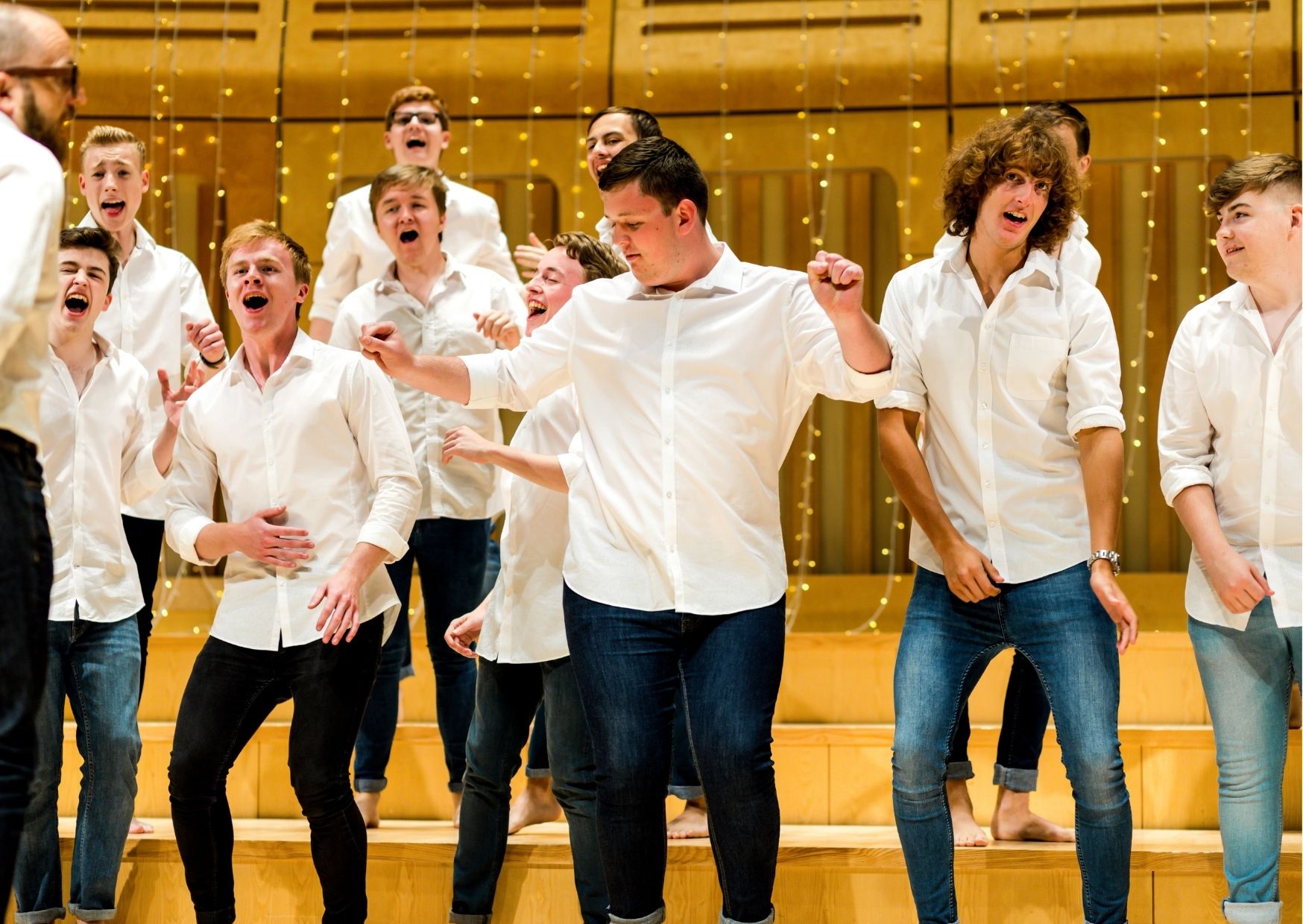 Young Men singing and dancing on stage