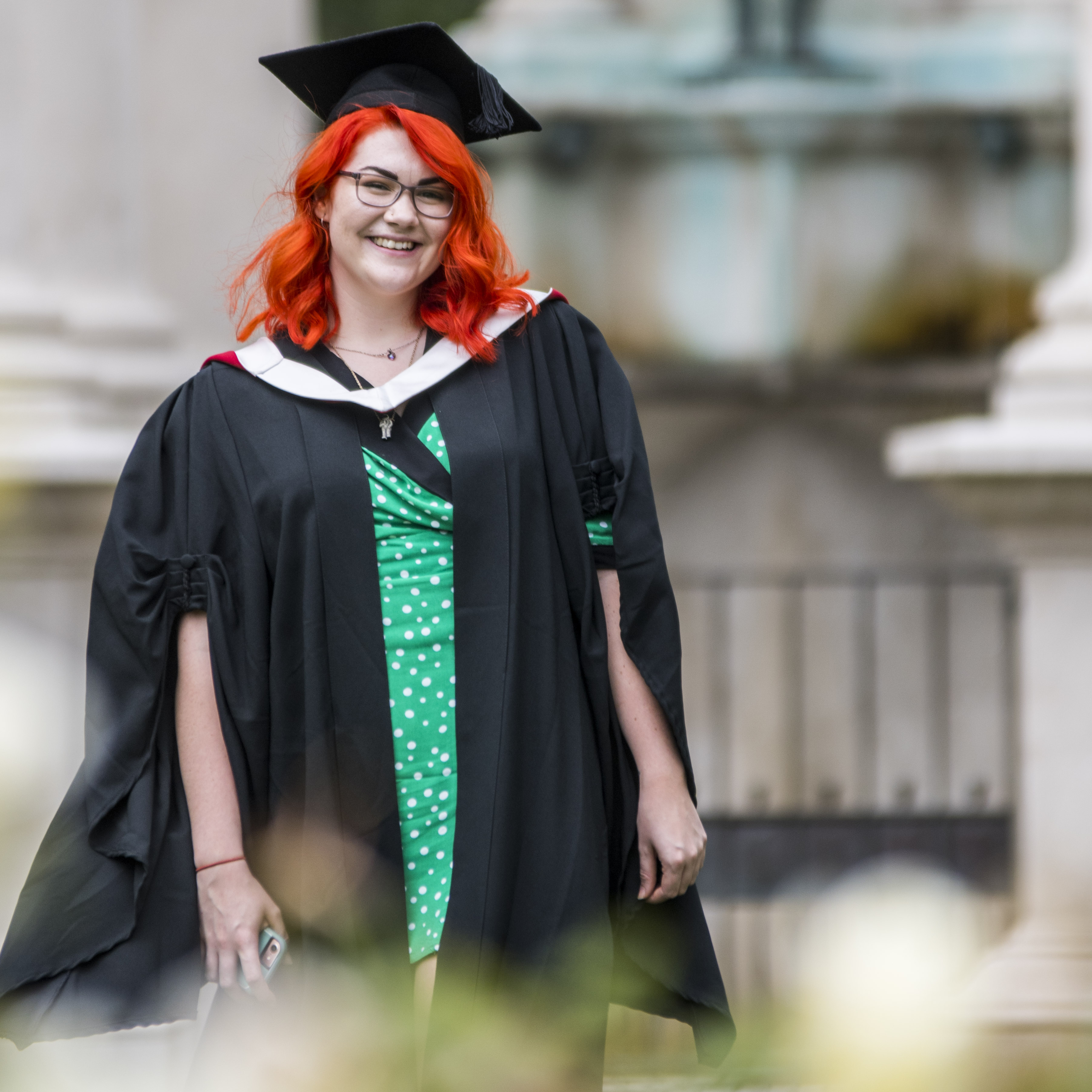 Portrait of a graduate with bright orange hair