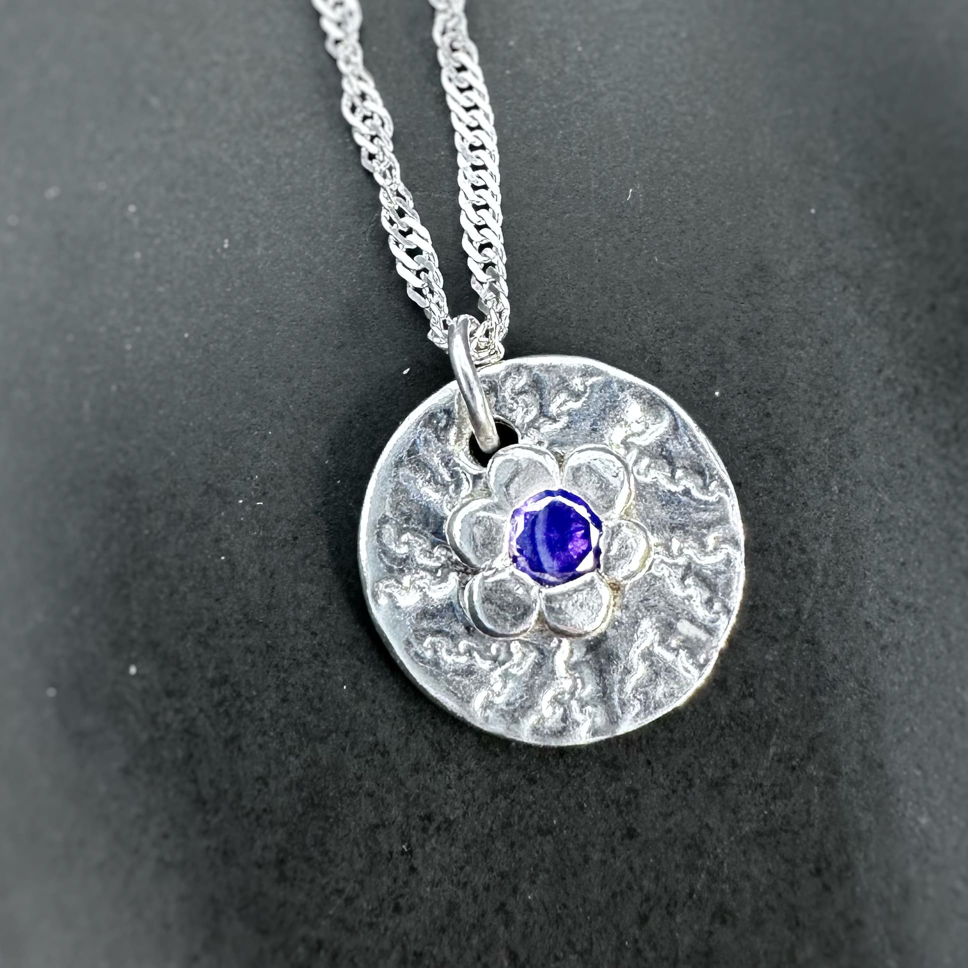 Birthstone pendant in a unique setting