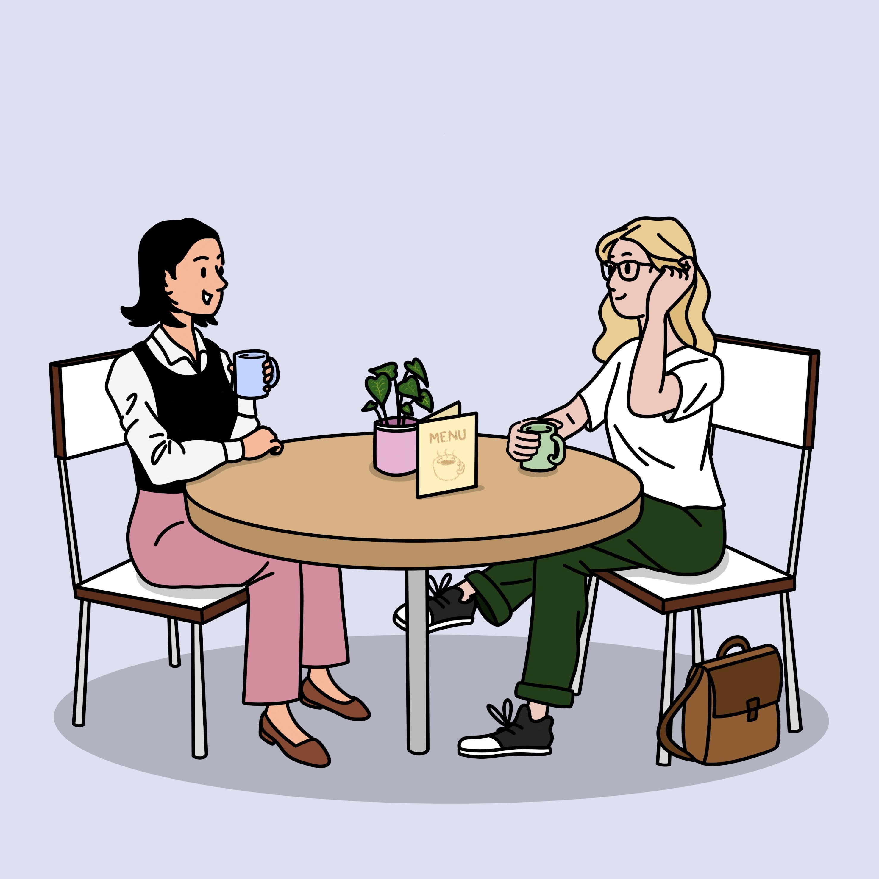 Two women chatting over coffee