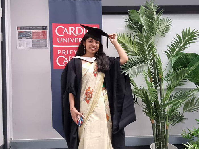 An image of Devika at graduation