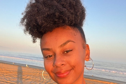 A picture of stylist Nicole Ready on a beach